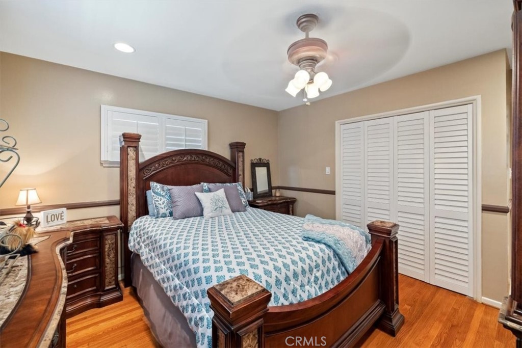 2065 Bronson Way Riverside, CA 92506 - Photo 37 of 75 a bedroom with a bed and a chandelier