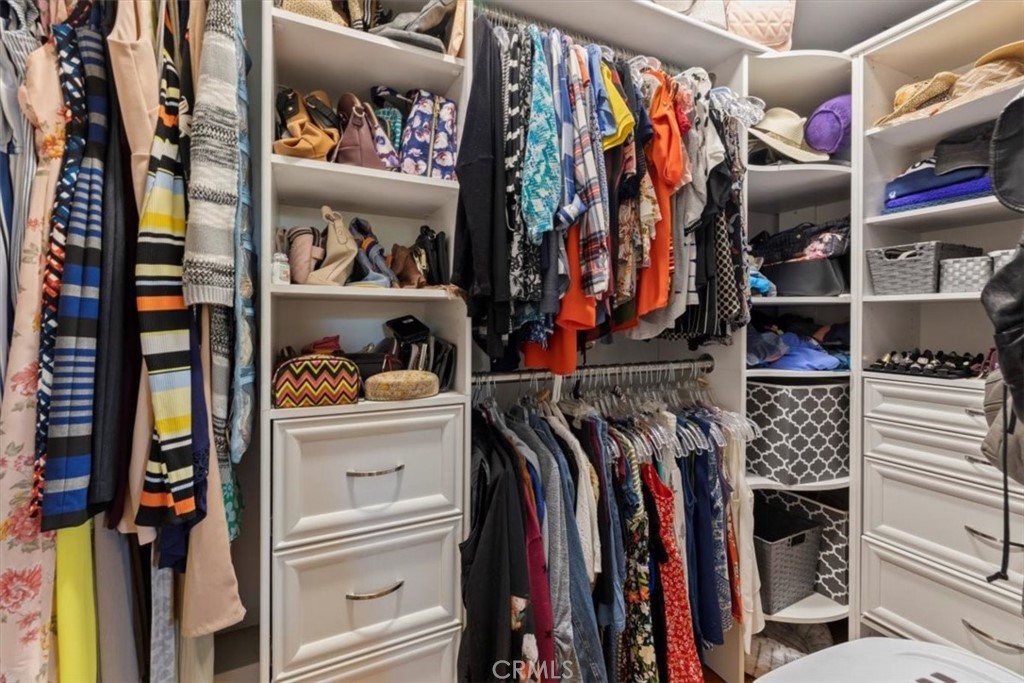 2065 Bronson Way Riverside, CA 92506 - Photo 41 of 75 a view of walk in closet with clothes and shoes