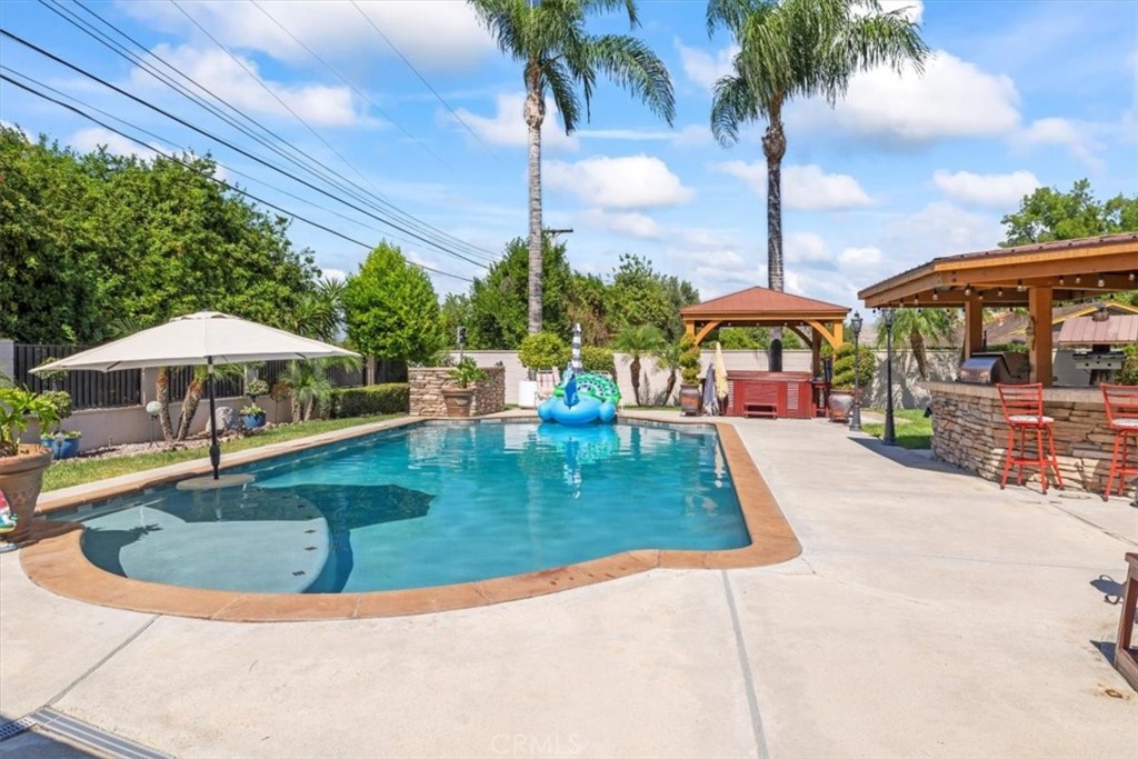 2065 Bronson Way Riverside, CA 92506 - Photo 47 of 75 a view of a swimming pool with a patio