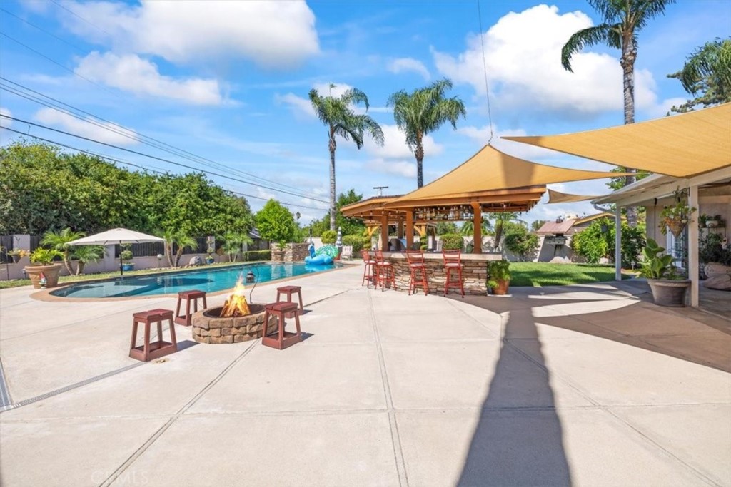 2065 Bronson Way Riverside, CA 92506 - Photo 49 of 75 a view of a swimming pool with a patio
