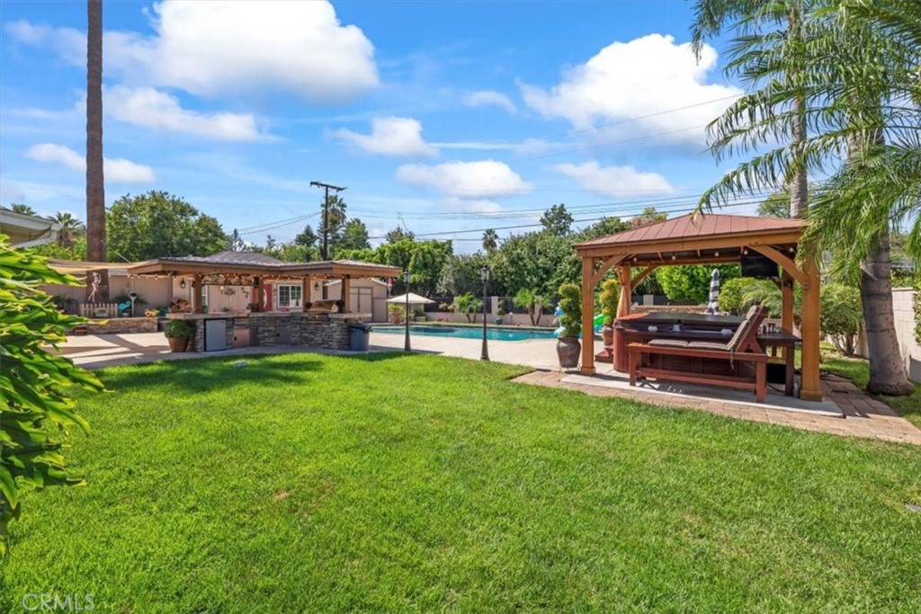 2065 Bronson Way Riverside, CA 92506 - Photo 53 of 75 a view of a yard with a table and chairs