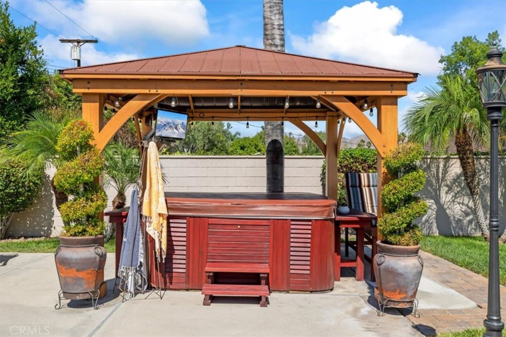 2065 Bronson Way Riverside, CA 92506 - Photo 55 of 75 a view of a patio with a table and chairs under an umbrella
