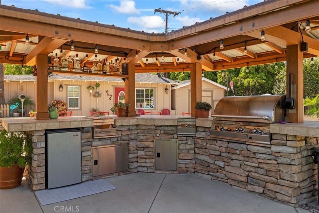 2065 Bronson Way Riverside, CA 92506 - Photo 58 of 75 a open kitchen with stainless steel appliances granite countertop a stove and a sink