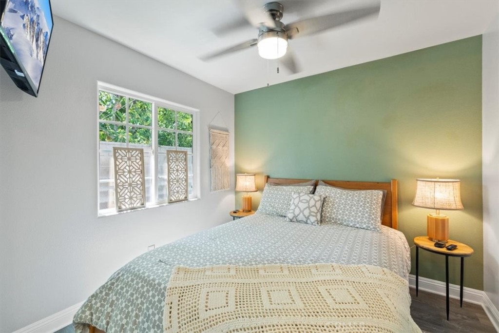 2065 Bronson Way Riverside, CA 92506 - Photo 68 of 75 a bedroom with a bed and a lamp