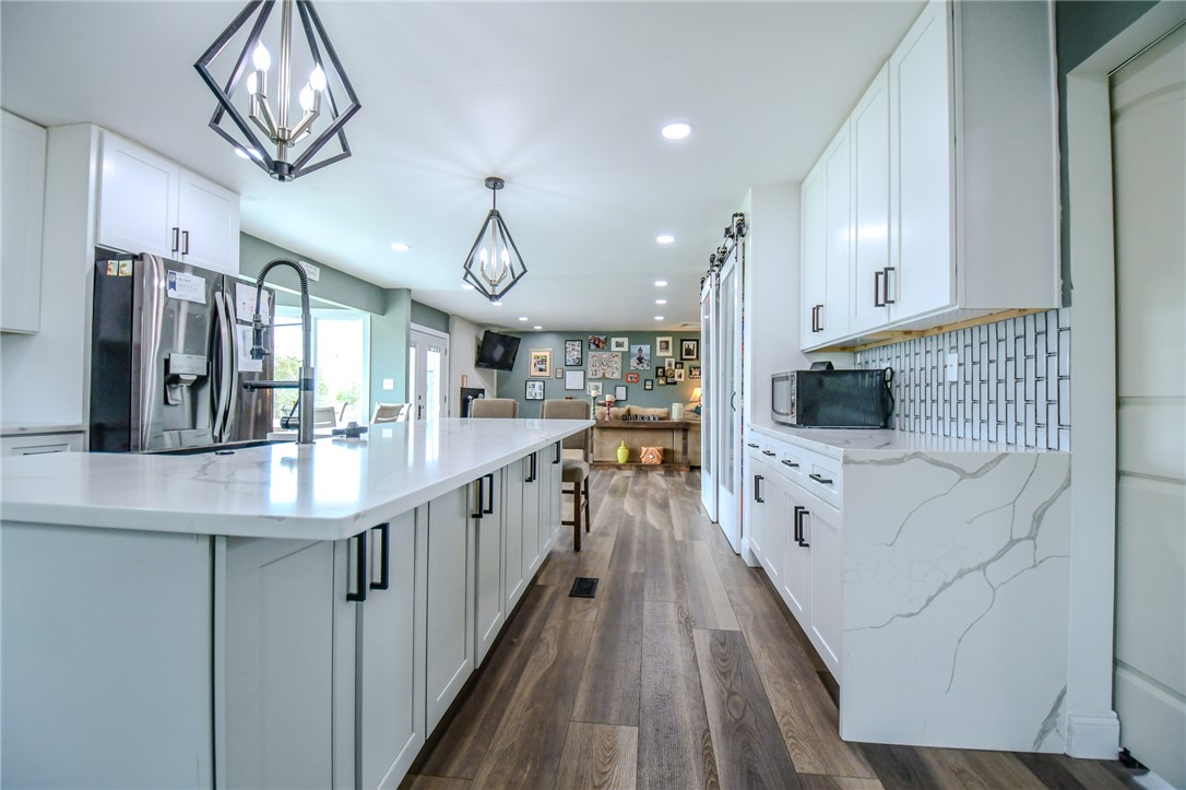 6169 Dayton Farmersville Road Dayton, OH 45417 - Photo 17 of 64 This spacious kitchen offers a large island, sleek countertops, and ample cabinetry for all your culinary needs.