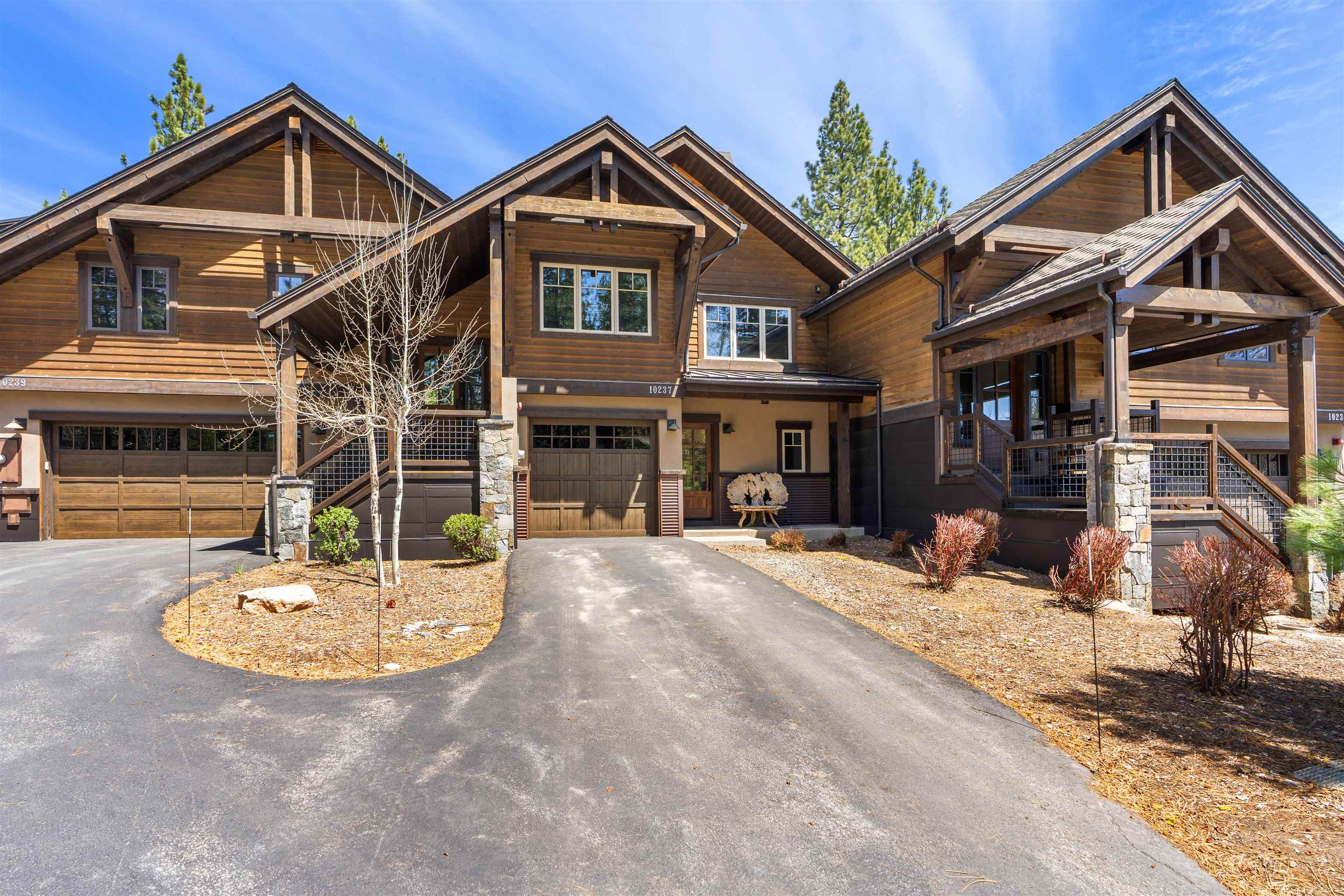 10237 Annies Loop, Unit A5 Truckee, CA 96161 - Photo 1 of 11 a front view of a house with a yard and garage