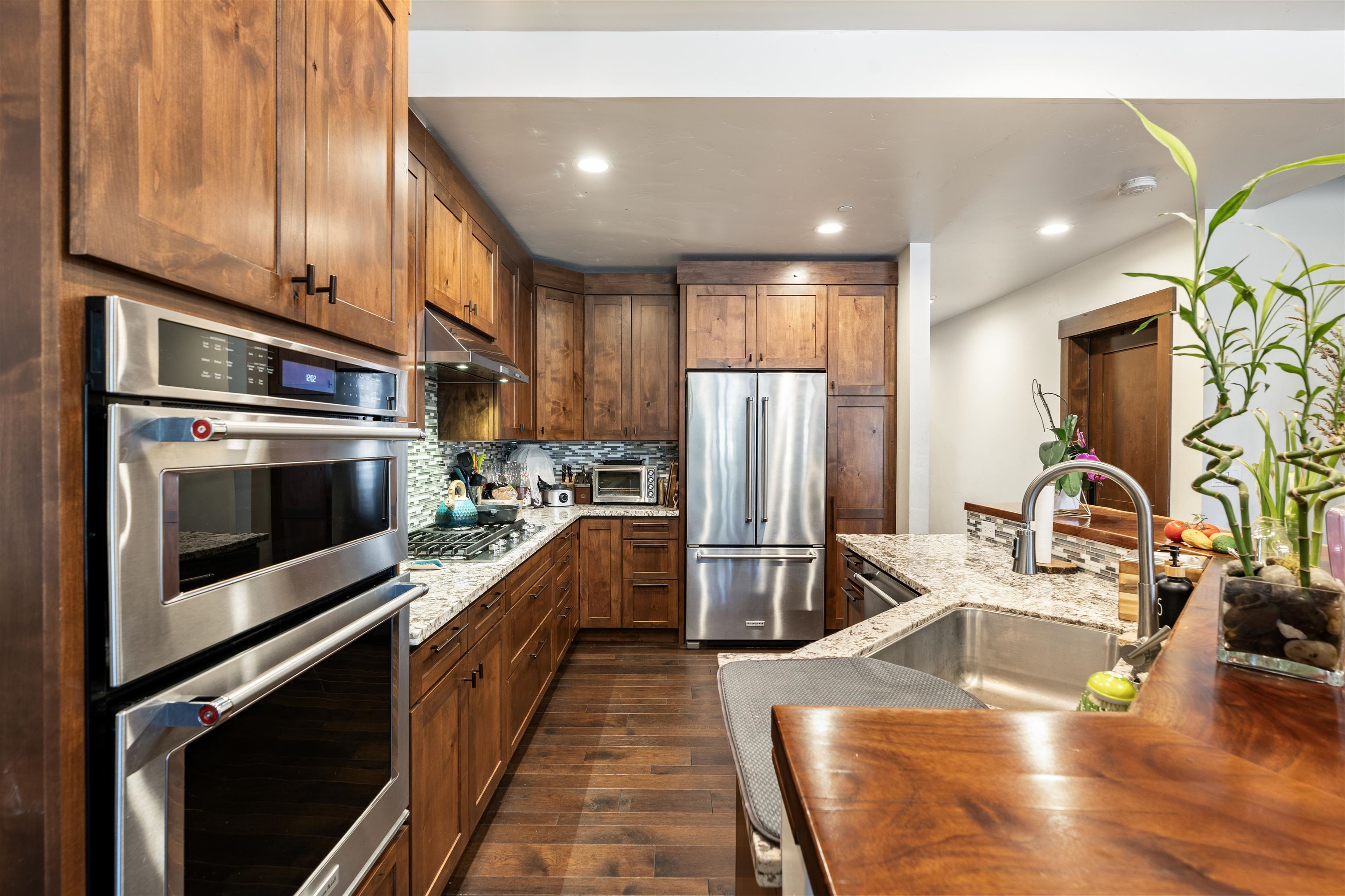 10237 Annies Loop, Unit A5 Truckee, CA 96161 - Photo 3 of 11 a kitchen with stainless steel appliances a stove a refrigerator and a sink