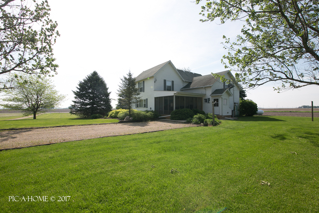 15063 Shabbona Road Malta, IL 60150 - Photo 1 of 25 a front view of house with yard and green space
