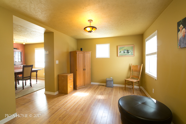 15063 Shabbona Road Malta, IL 60150 - Photo 13 of 25 a view of a livingroom with furniture and hardwood floor
