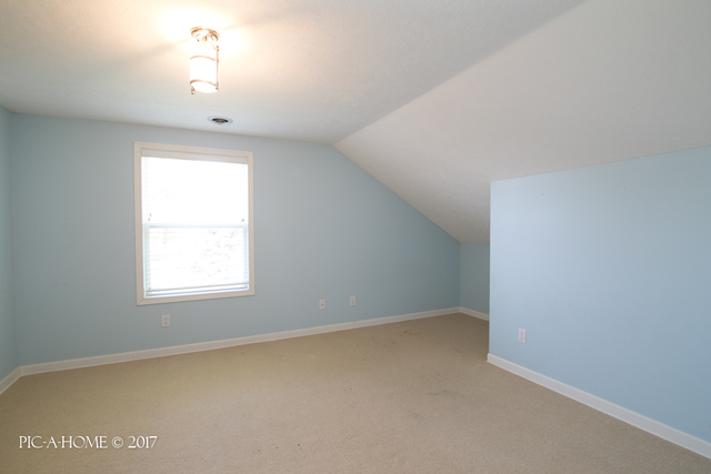 15063 Shabbona Road Malta, IL 60150 - Photo 18 of 25 an empty room with a window