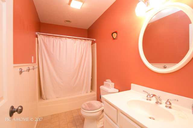 15063 Shabbona Road Malta, IL 60150 - Photo 19 of 25 a bathroom with a sink and a mirror