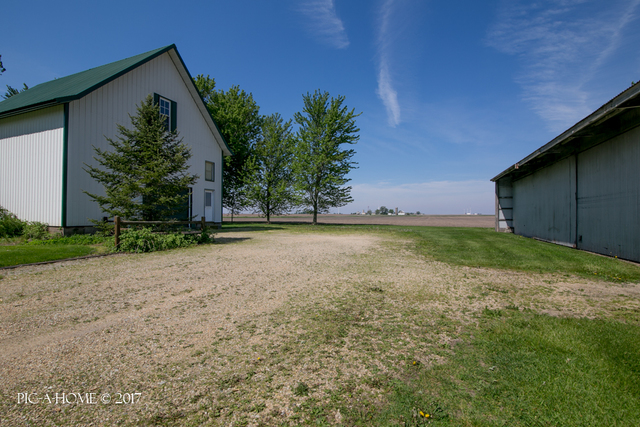 15063 Shabbona Road Malta, IL 60150 - Photo 22 of 25 a view of a house with a yard