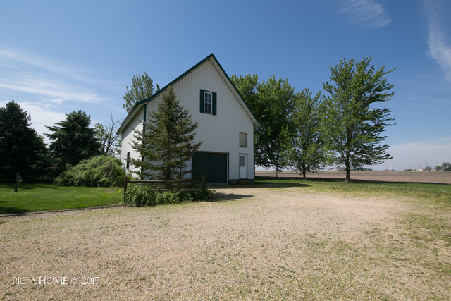 15063 Shabbona Road Malta, IL 60150 - Photo 23 of 25 a view of a house with a yard and garage