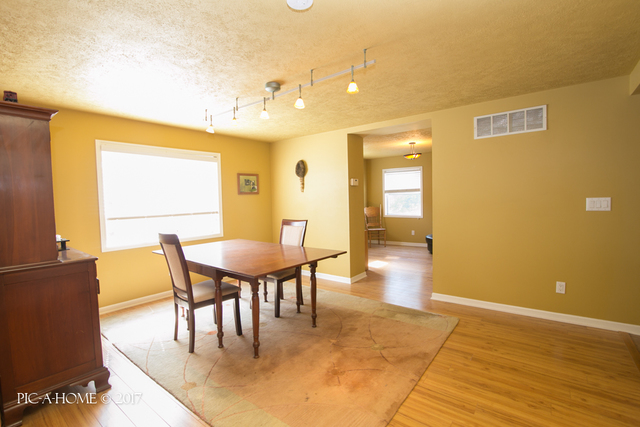 15063 Shabbona Road Malta, IL 60150 - Photo 6 of 25 a view of a dining room with furniture and wooden floor