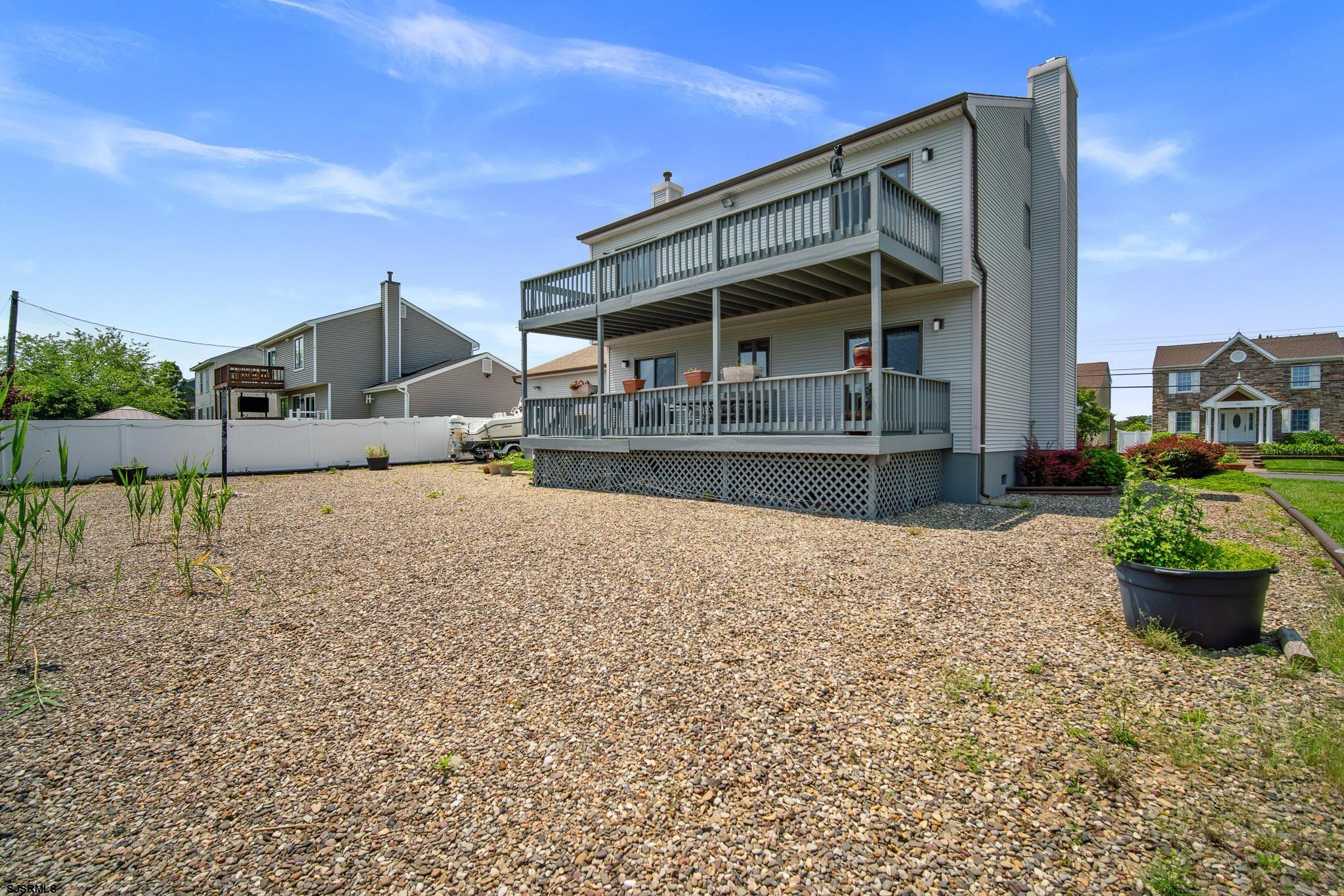 217 Hagen Road Brigantine, NJ 08203 - Photo 38 of 63 a front view of a house with a yard