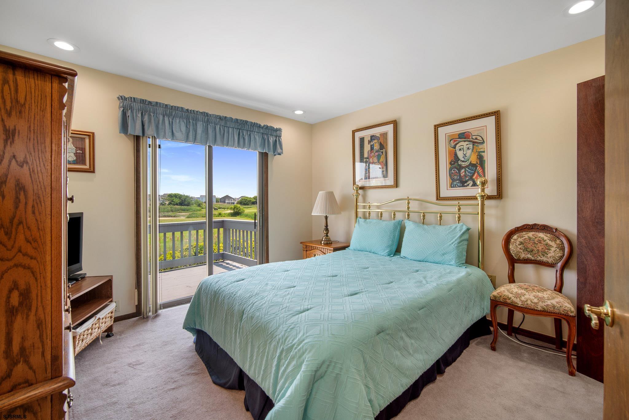 217 Hagen Road Brigantine, NJ 08203 - Photo 39 of 63 a bedroom with a bed a couch and a window