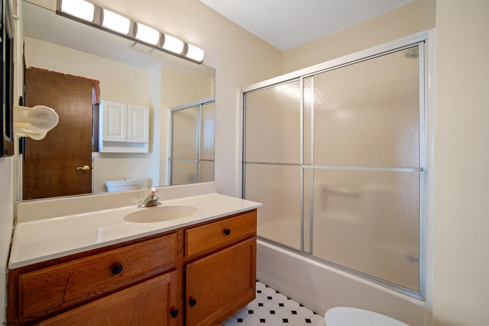 217 Hagen Road Brigantine, NJ 08203 - Photo 43 of 63 a bathroom with a sink and a mirror