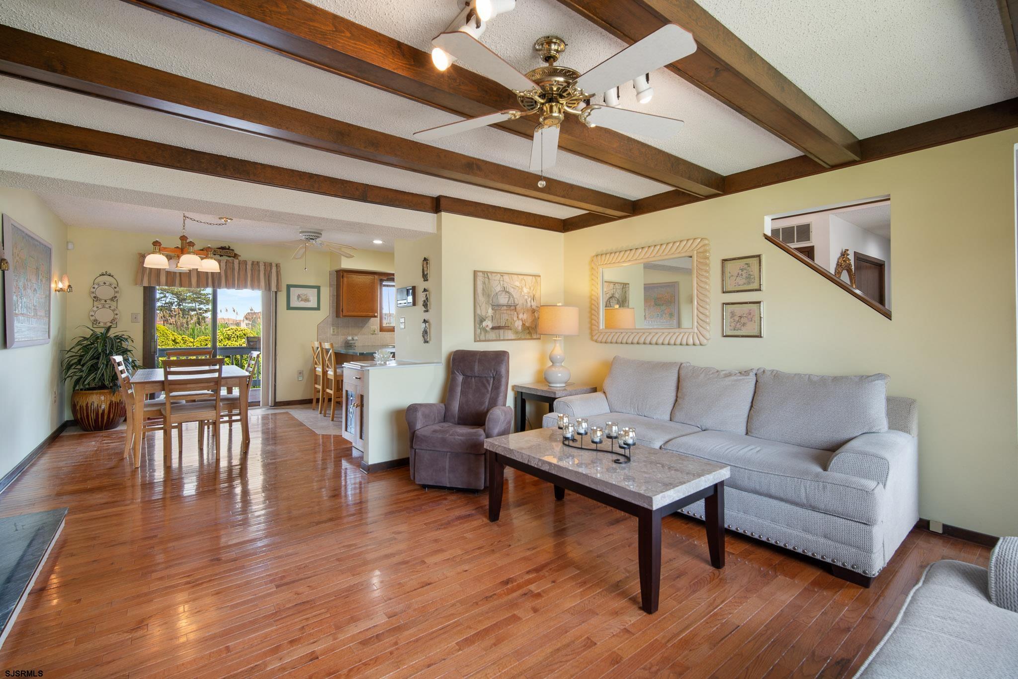 217 Hagen Road Brigantine, NJ 08203 - Photo 46 of 63 a living room with furniture wooden floor and a chandelier