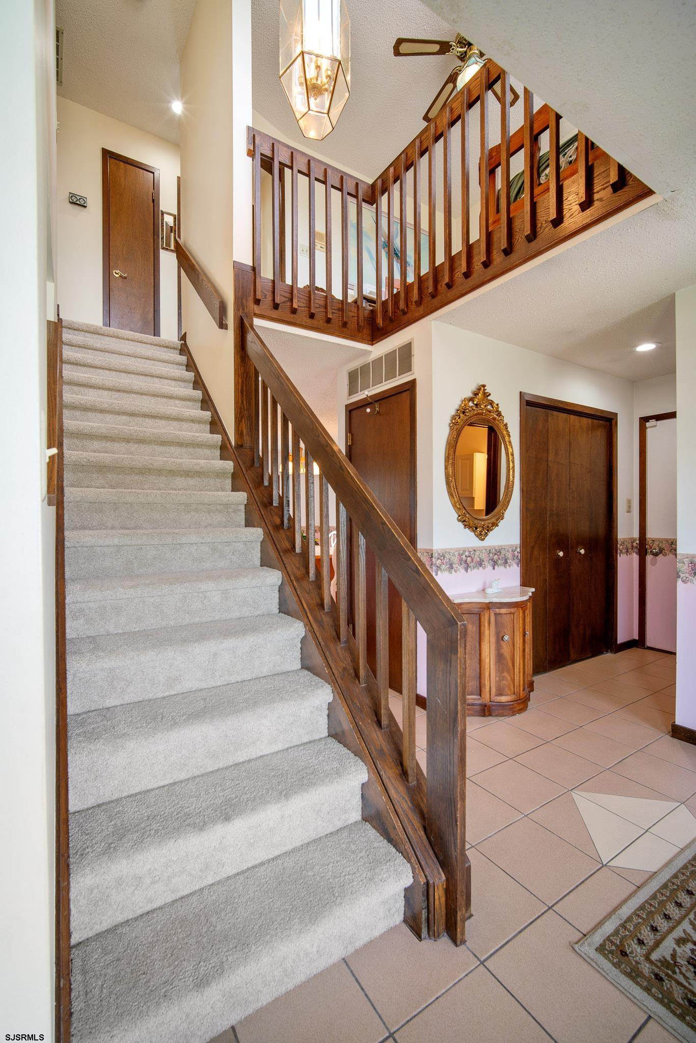 217 Hagen Road Brigantine, NJ 08203 - Photo 47 of 63 a view of entryway kitchen and hall way with wooden floor