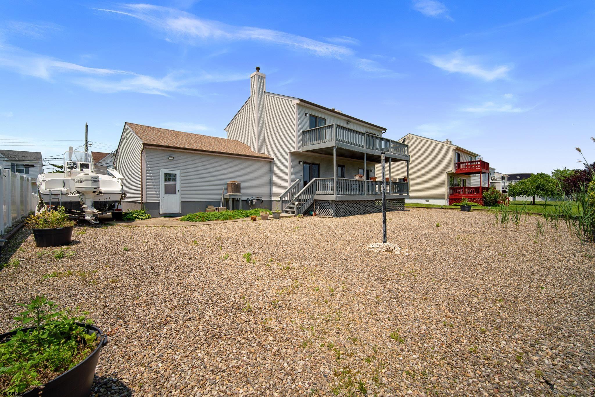 217 Hagen Road Brigantine, NJ 08203 - Photo 51 of 63 a front view of a house with a yard