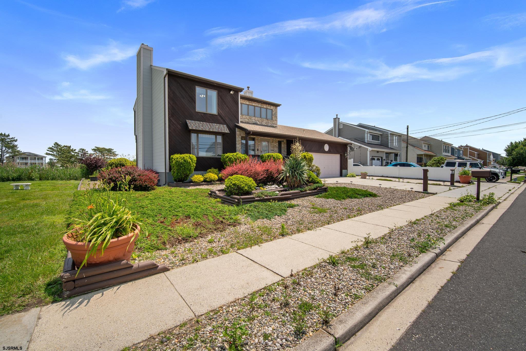 217 Hagen Road Brigantine, NJ 08203 - Photo 52 of 63 a front view of building with yard