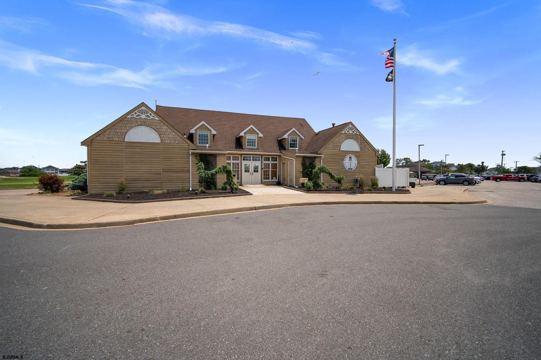 217 Hagen Road Brigantine, NJ 08203 - Photo 53 of 63 a front view of a house with a yard and parking