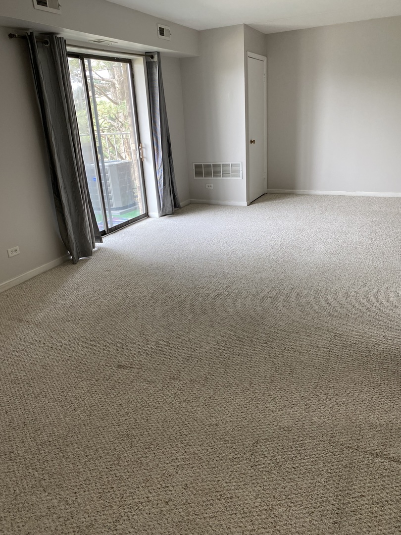 Undisclosed Address Schaumburg, IL 60193 - Photo 4 of 17 a view of empty room with windows