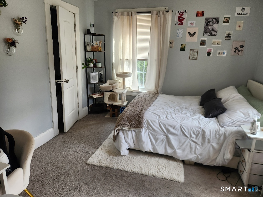 249 Church Street Windham, CT 06226 - Photo 8 of 10 a bedroom with a bed and a window