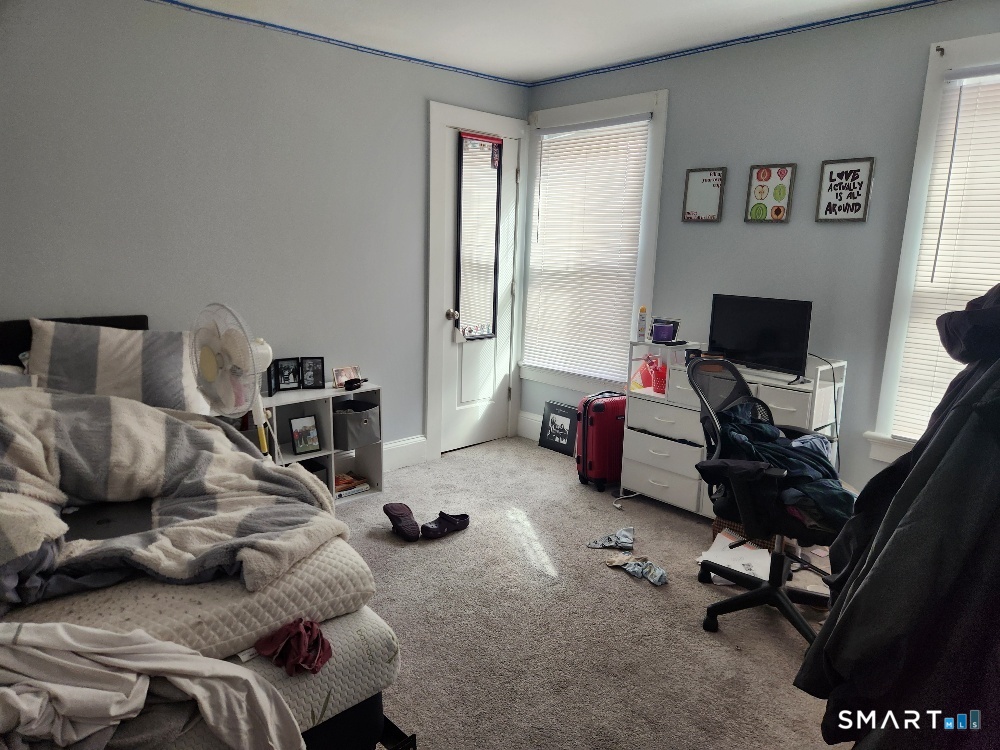 249 Church Street Windham, CT 06226 - Photo 9 of 10 a bedroom with furniture and a window