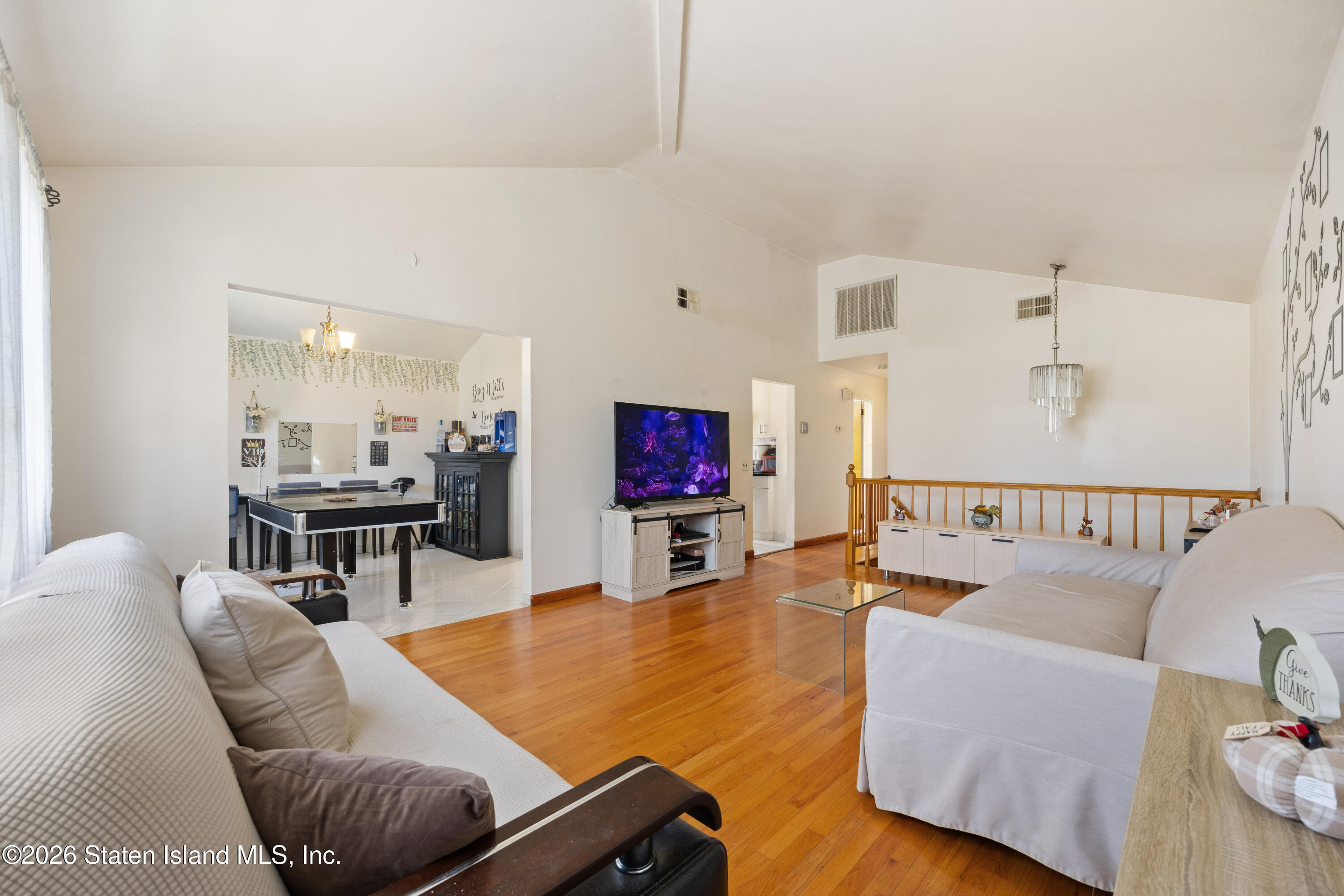 62 Bennett Place Staten Island, NY 10312 - Photo 15 of 34 a living room with furniture and a flat screen tv