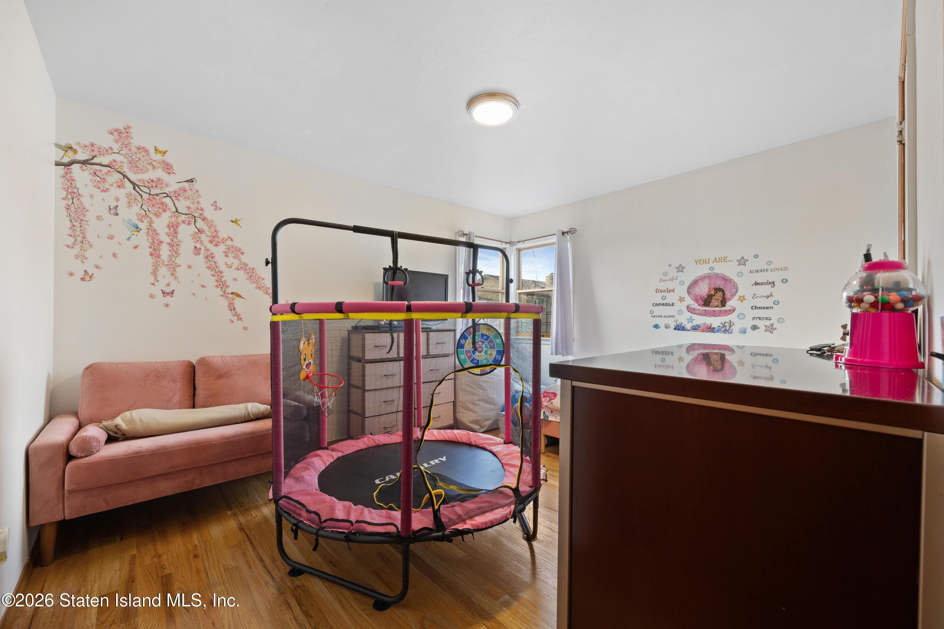 62 Bennett Place Staten Island, NY 10312 - Photo 22 of 34 a living room with furniture and a rug