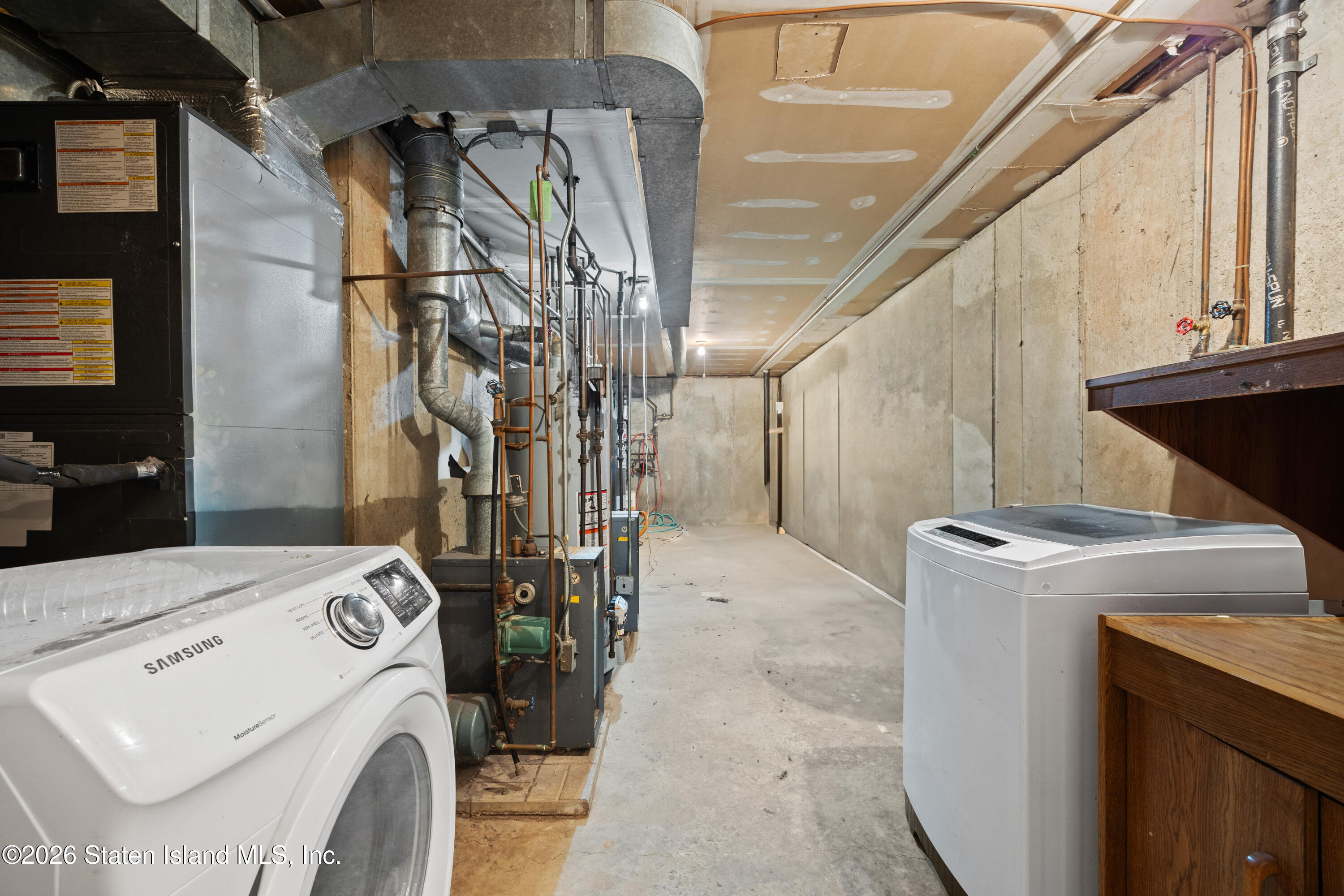 62 Bennett Place Staten Island, NY 10312 - Photo 28 of 34 a utility room with dryer and washer