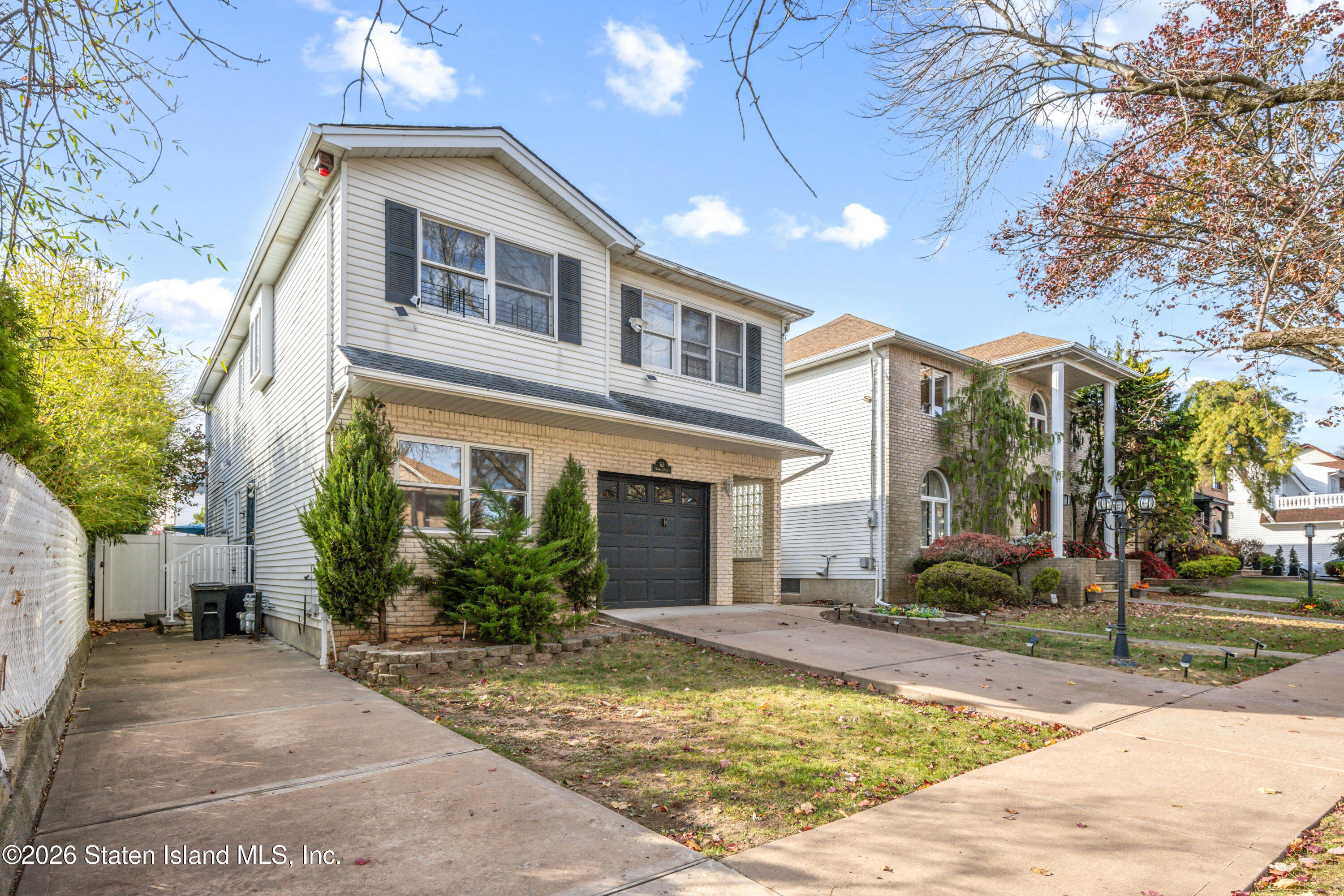 62 Bennett Place Staten Island, NY 10312 - Photo 29 of 34 a front view of a house with garden