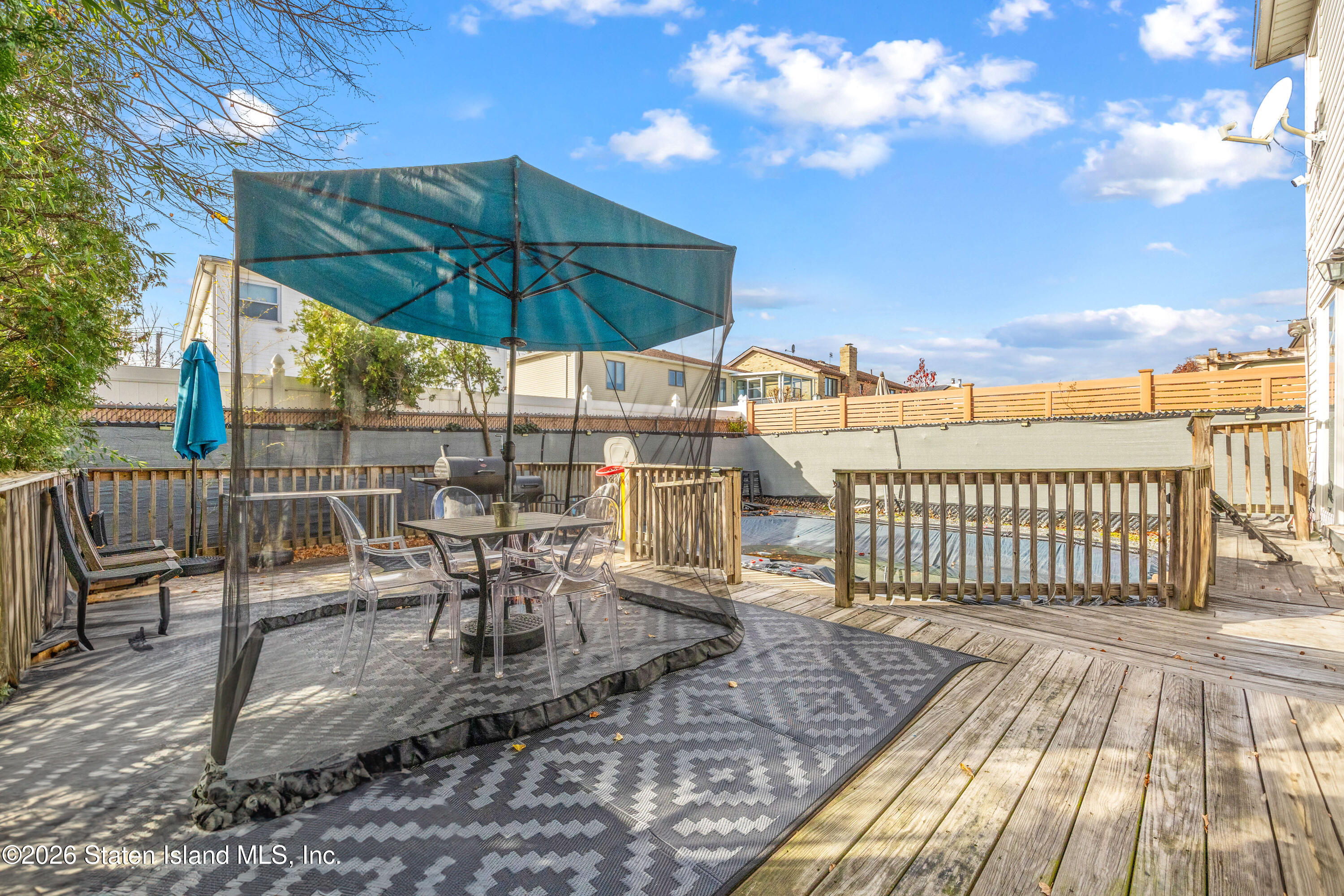 62 Bennett Place Staten Island, NY 10312 - Photo 10 of 34 a view of a chairs and table in the patio