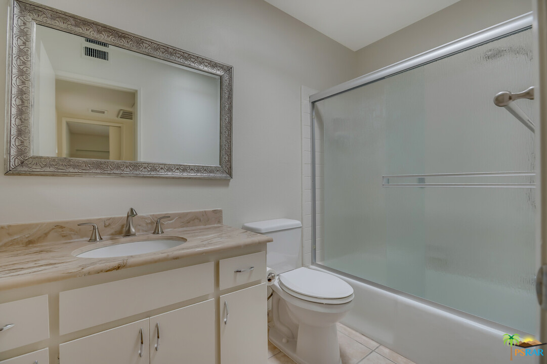 1111 East Ramon Road, Unit 69 Palm Springs, CA 92264 - Photo 13 of 20 a bathroom with a sink a toilet and shower