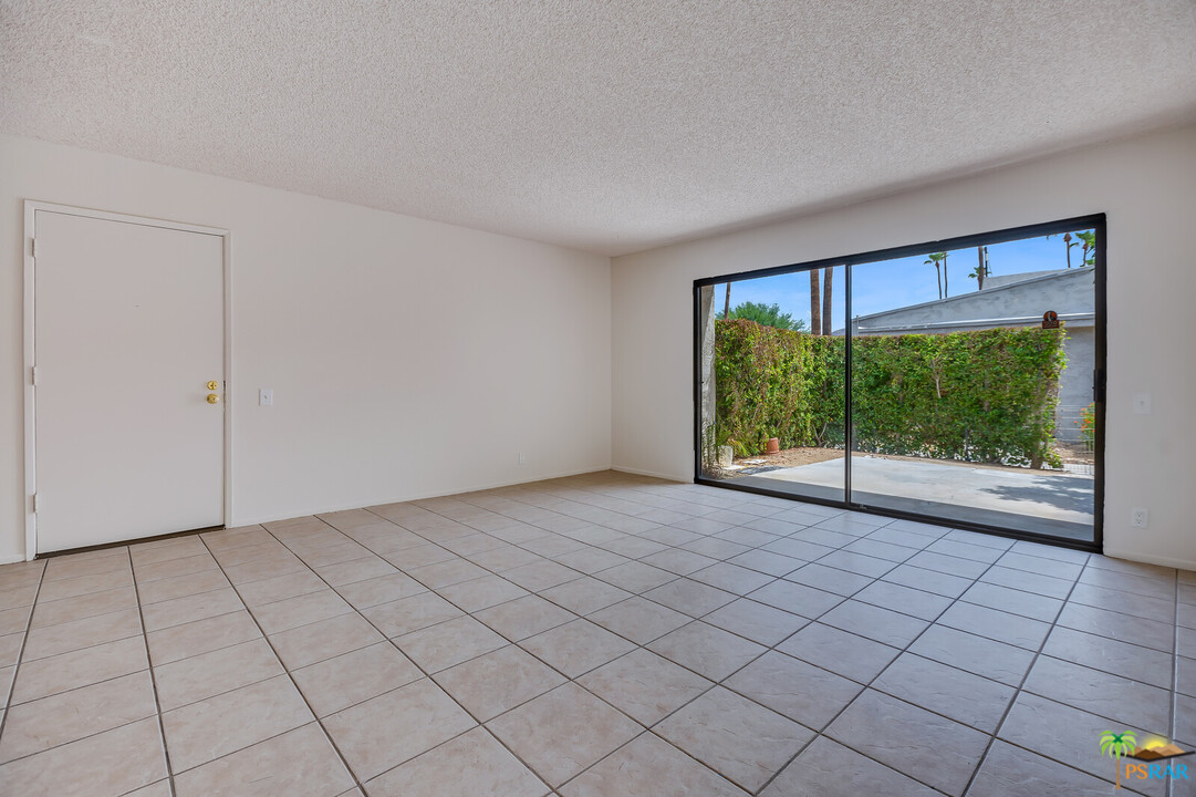 1111 East Ramon Road, Unit 69 Palm Springs, CA 92264 - Photo 3 of 20 a view of an empty room with a window