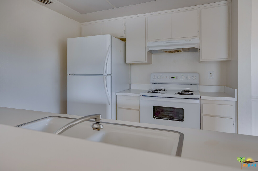 1111 East Ramon Road, Unit 69 Palm Springs, CA 92264 - Photo 5 of 20 a utility room with sink dryer and washer