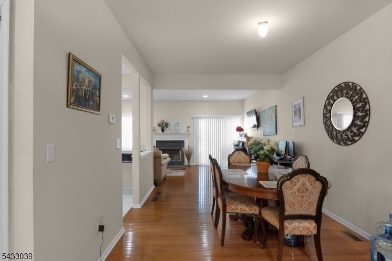 158 Autumn Ridge Road Morris Plains, NJ 07950 - Photo 9 of 26 a dining room with furniture and a mirror