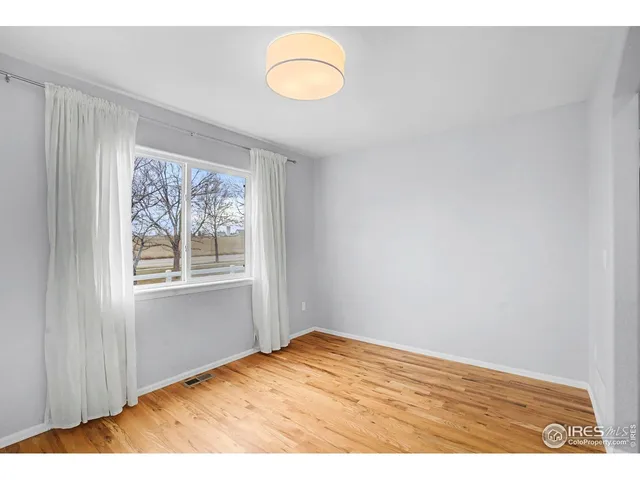 a kitchen with a sink a cabinets and window