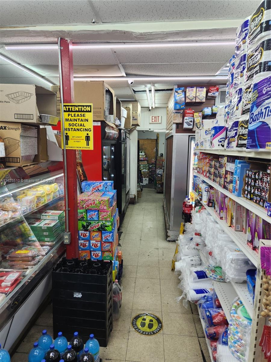 225 Northwest 17th Street Miami, FL 33136 - Photo 4 of 11 a store room filled with lots of different furniture and a chandelier