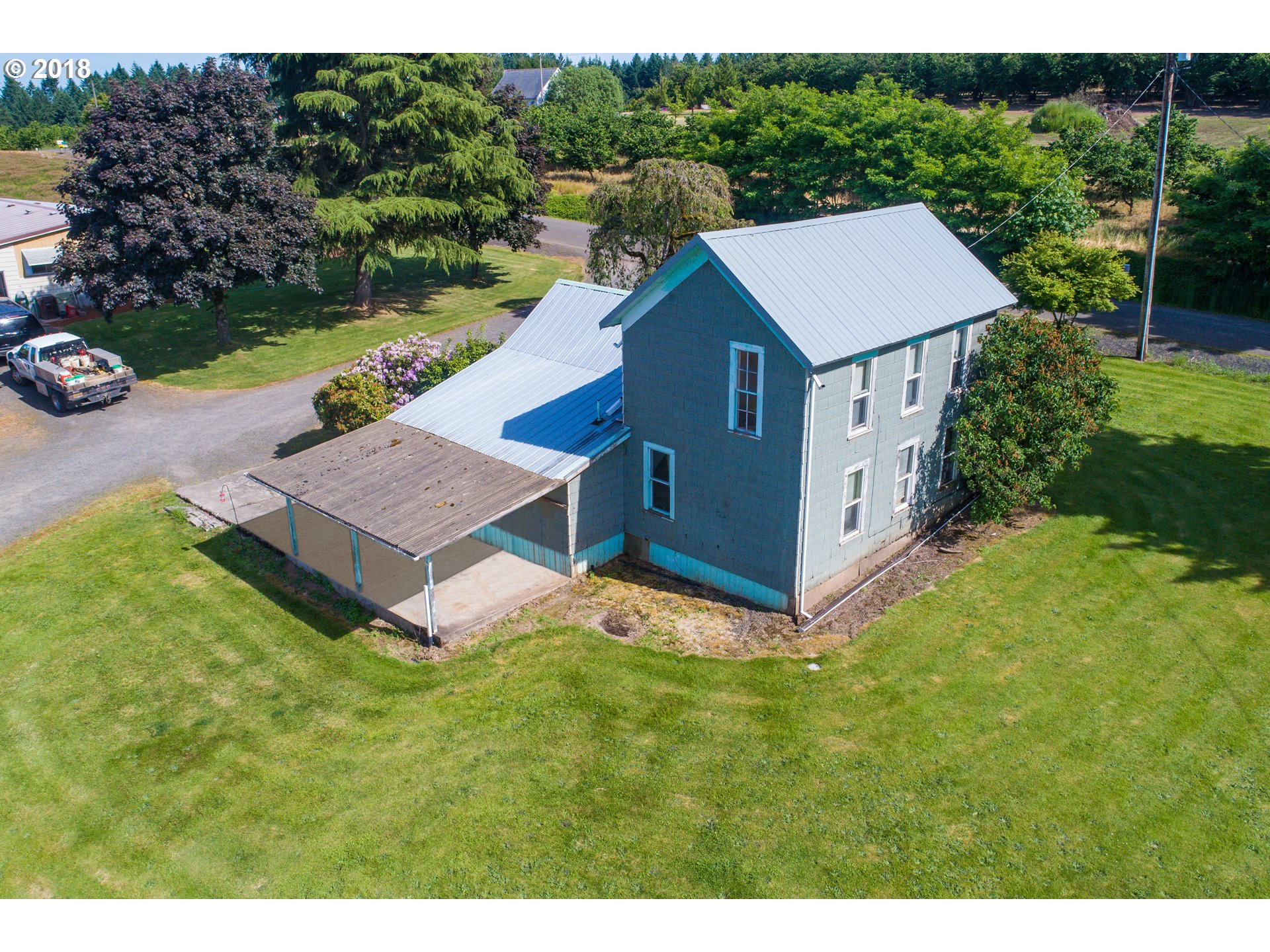 33555 Southwest Firdale Road Cornelius, OR 97113 - Photo 8 of 23 a view of a house with a yard and sitting area