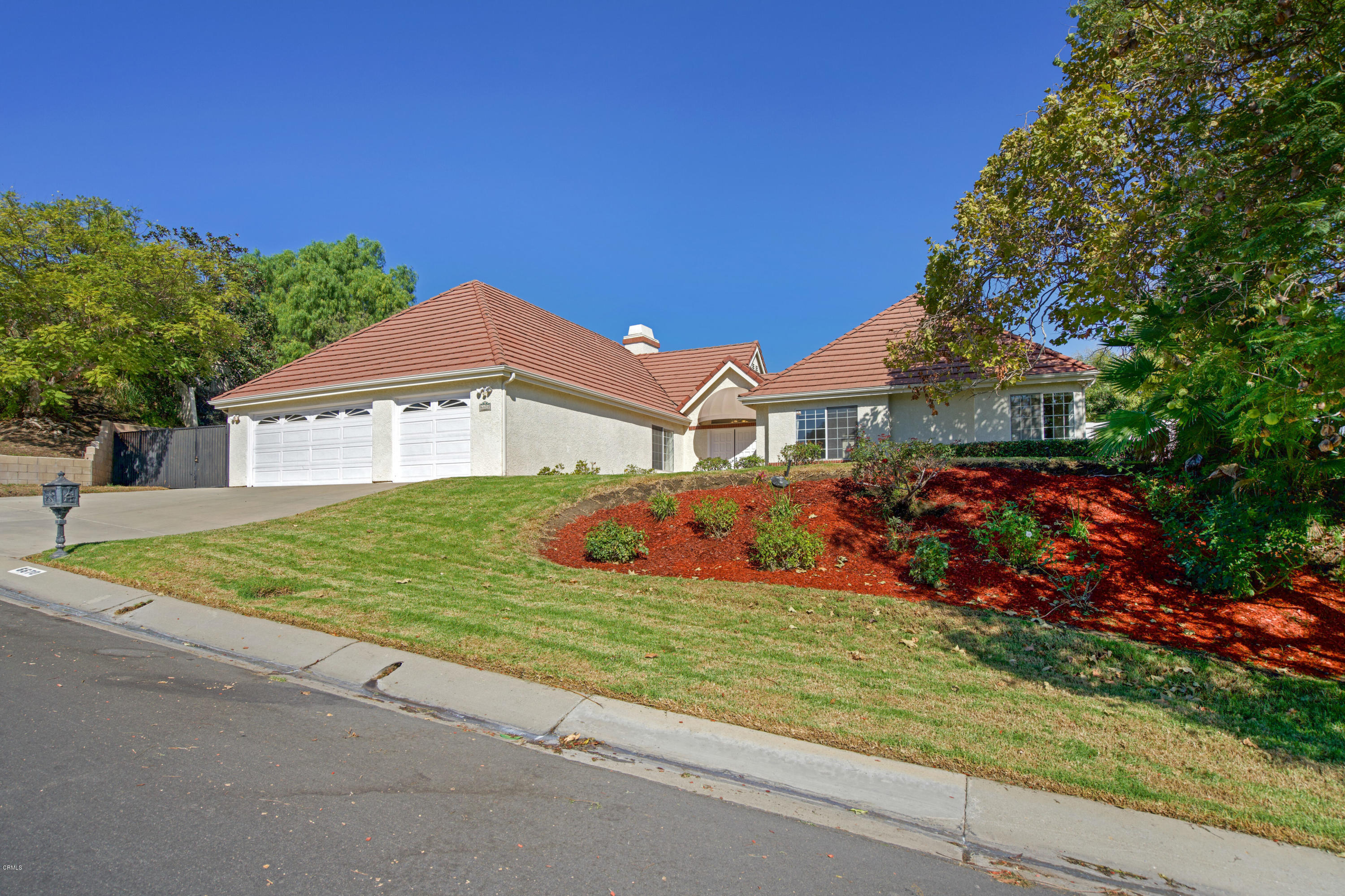 6670 Armitos Drive Camarillo, CA 93012 - Photo 2 of 35 a front view of a house with a yard