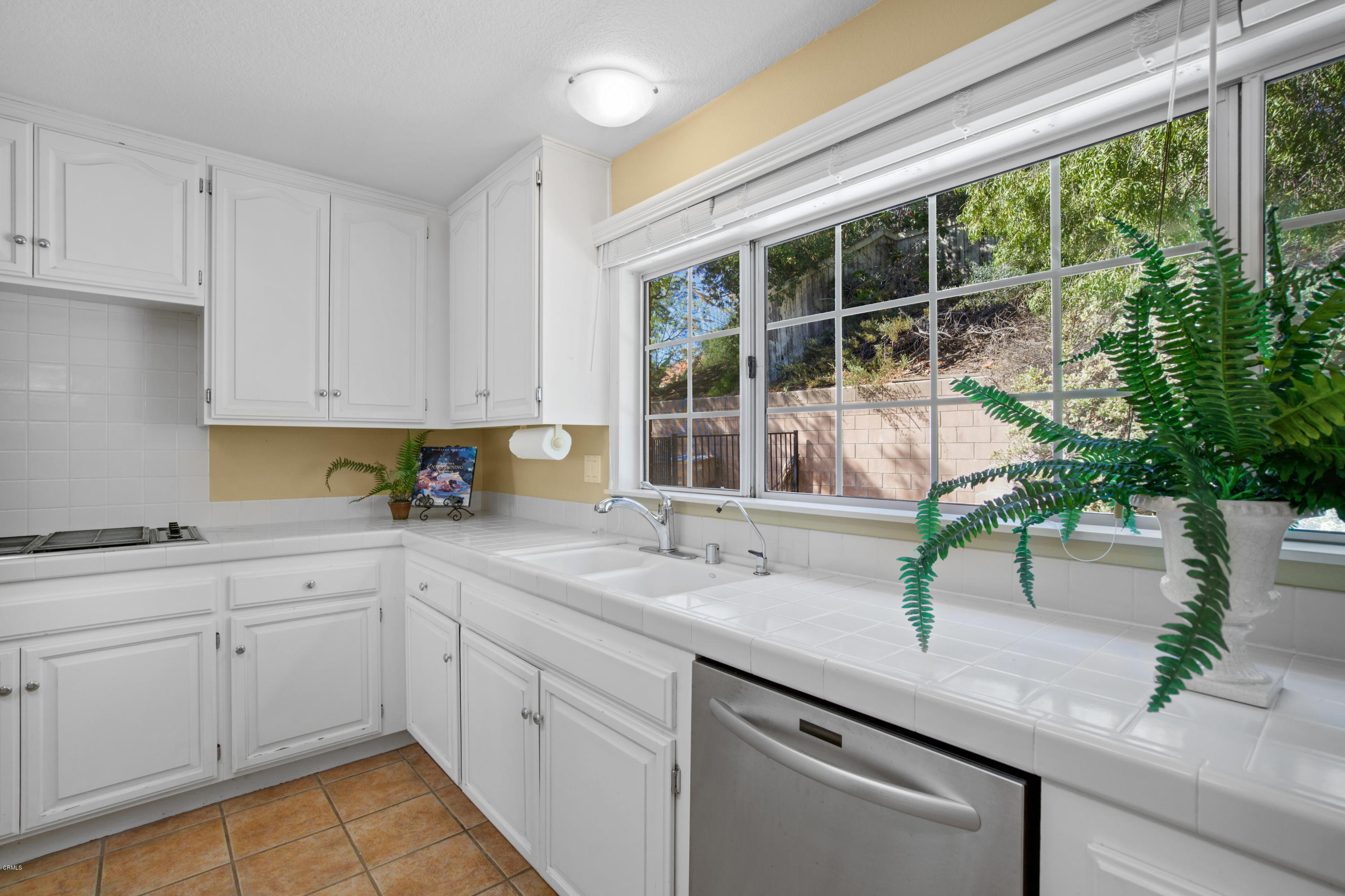 6670 Armitos Drive Camarillo, CA 93012 - Photo 14 of 35 a kitchen with a sink and cabinets