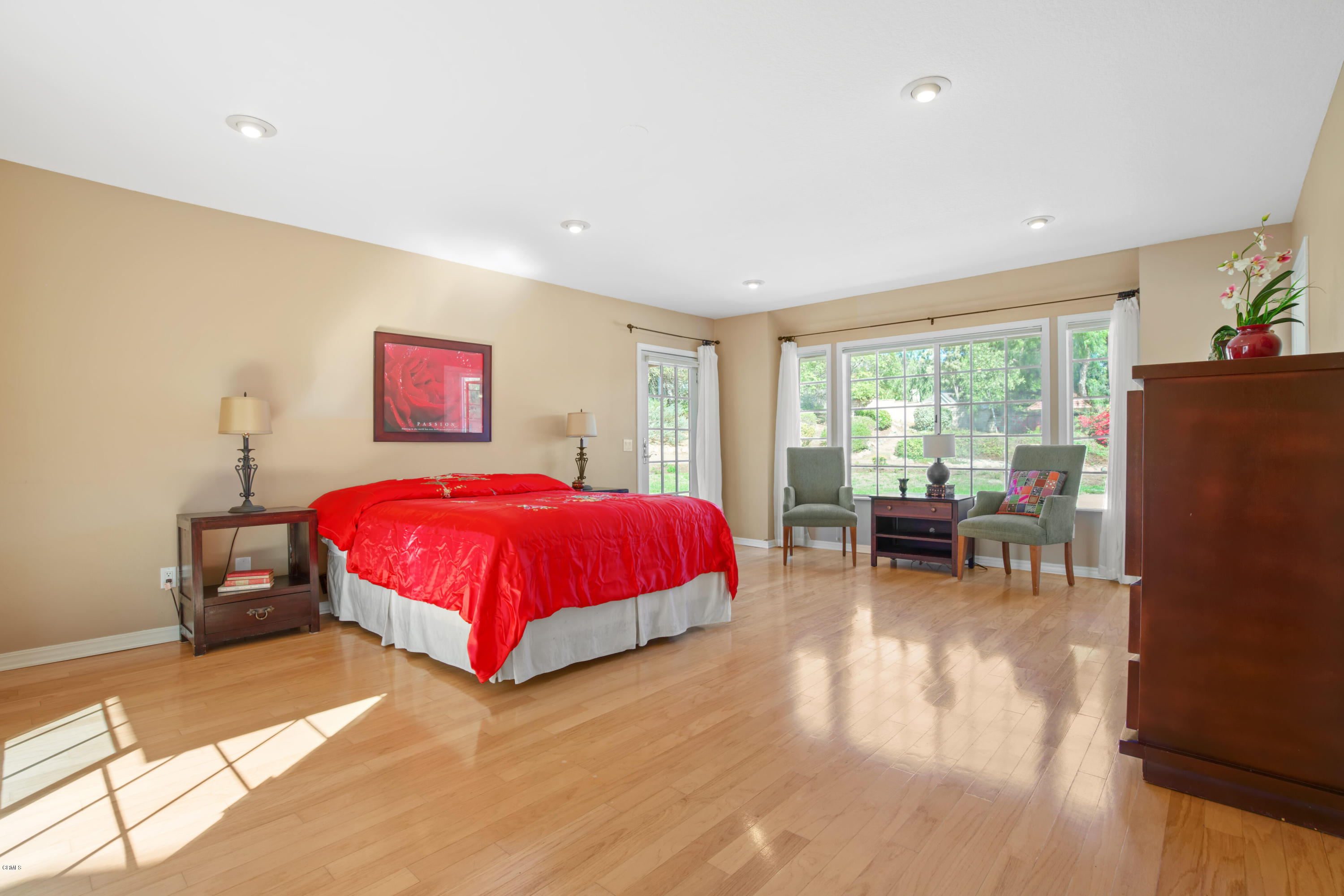 6670 Armitos Drive Camarillo, CA 93012 - Photo 18 of 35 a spacious bedroom with a bed and a large window