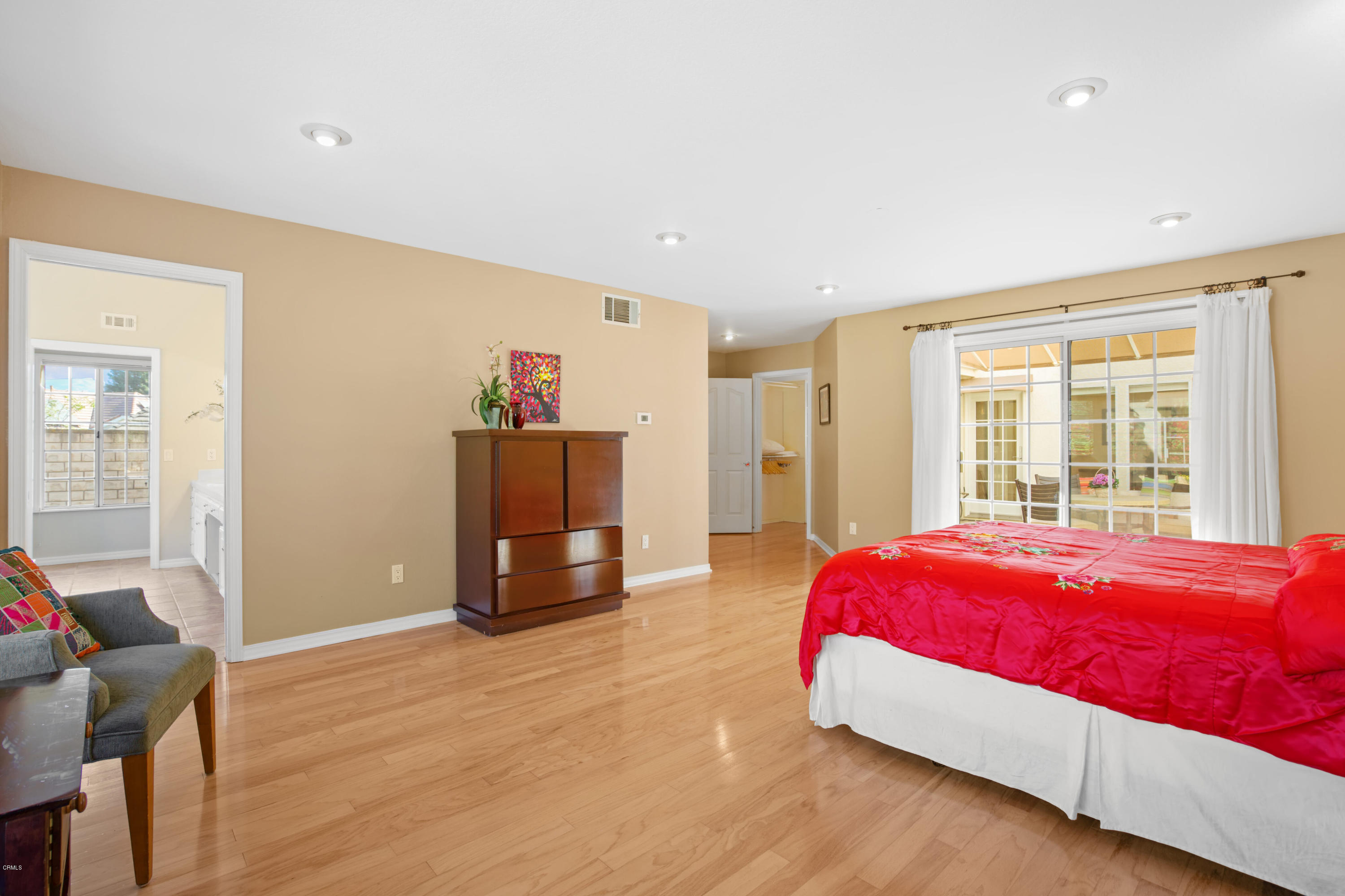 6670 Armitos Drive Camarillo, CA 93012 - Photo 19 of 35 a bedroom with a bed and wooden floor