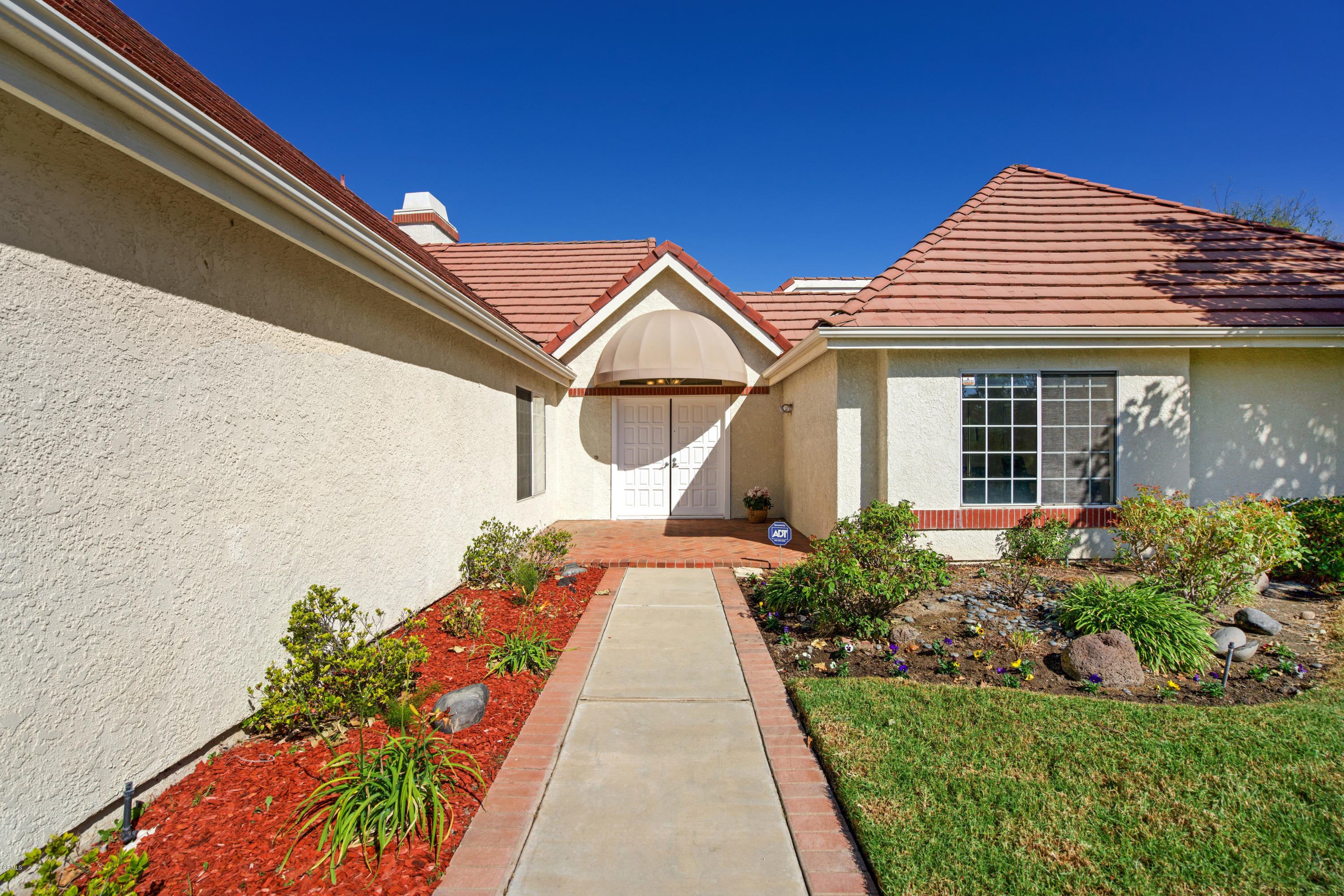 6670 Armitos Drive Camarillo, CA 93012 - Photo 3 of 35 a front view of a house with a yard