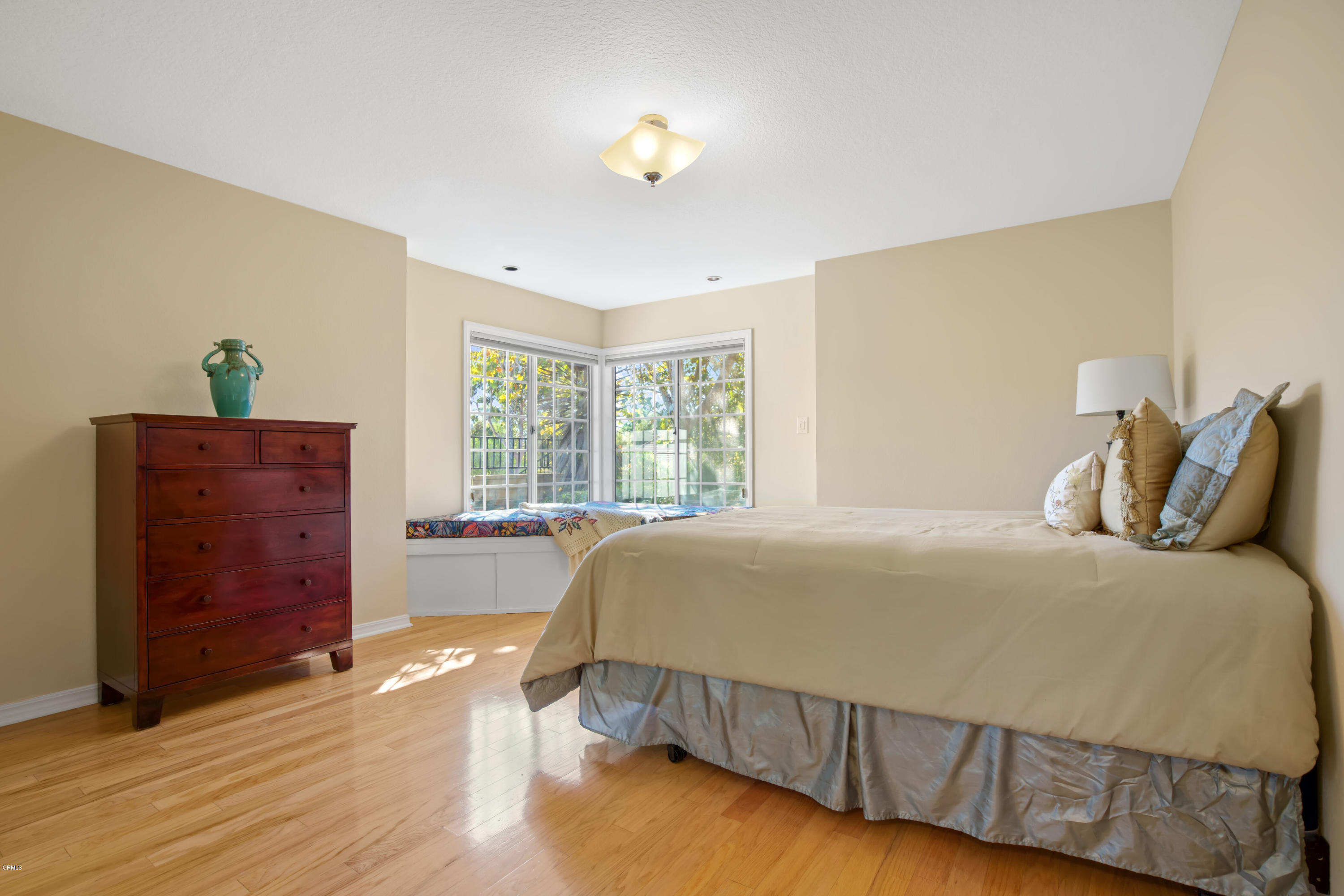 6670 Armitos Drive Camarillo, CA 93012 - Photo 25 of 35 a bedroom with a bed and a dresser