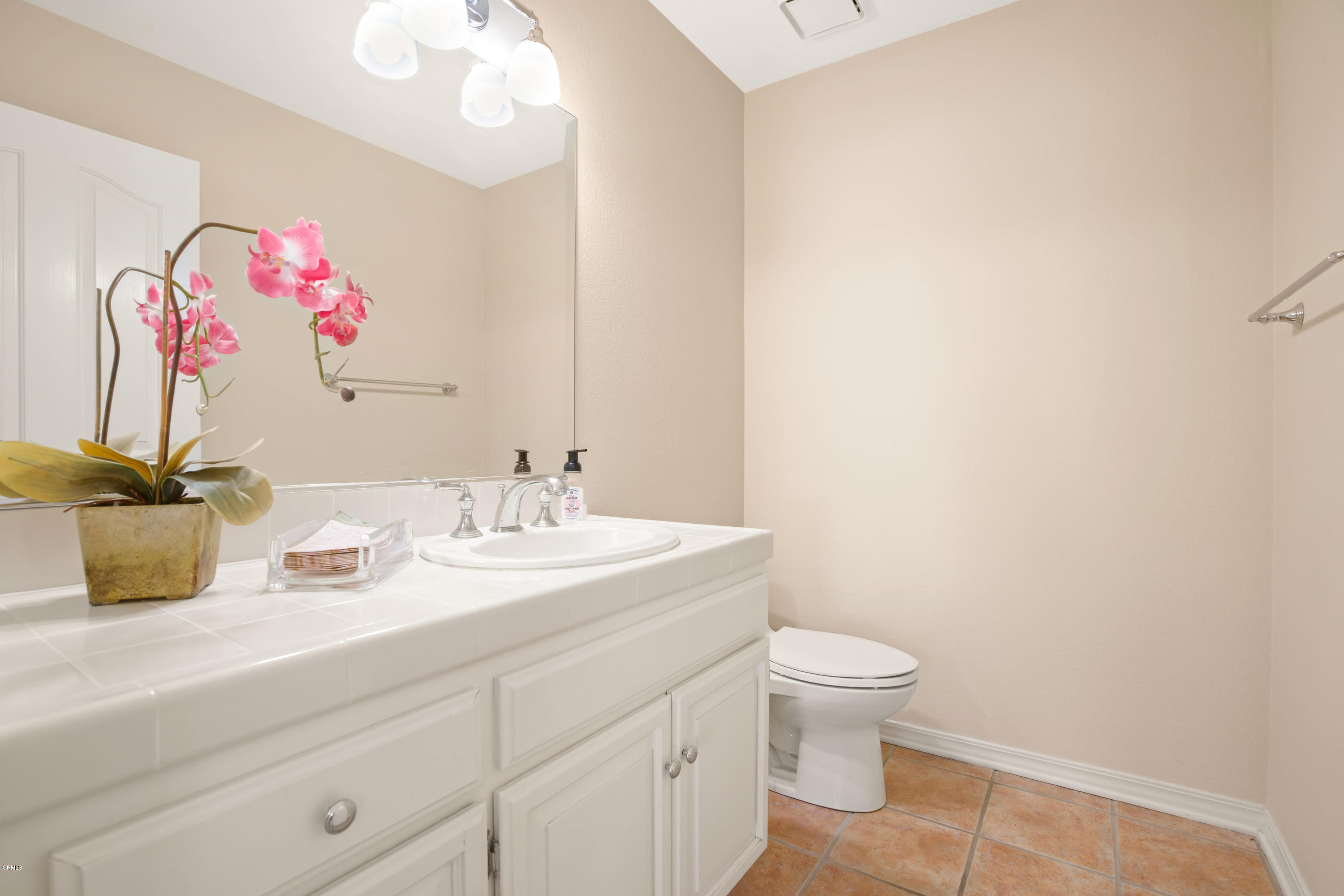 6670 Armitos Drive Camarillo, CA 93012 - Photo 29 of 35 a bathroom with a granite countertop sink a toilet and a mirror