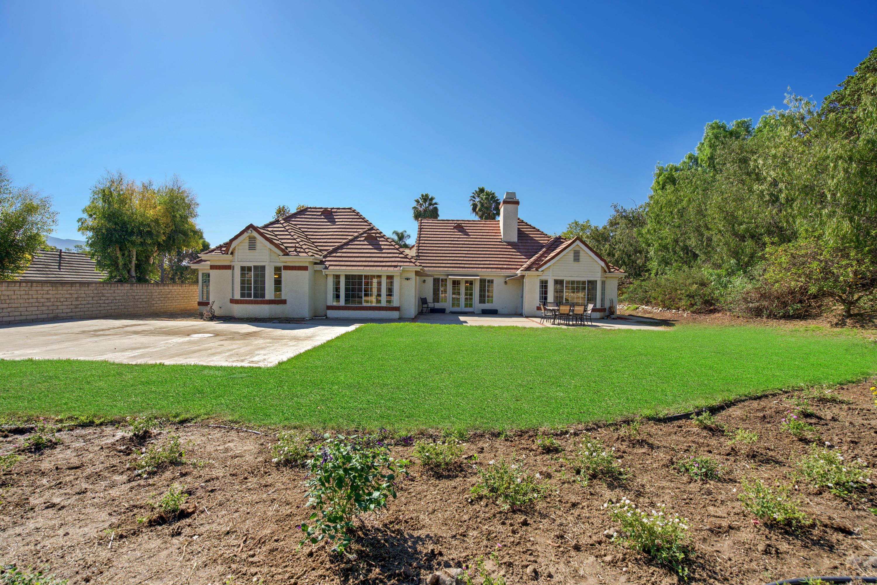 6670 Armitos Drive Camarillo, CA 93012 - Photo 34 of 35 a view of house with garden and tall trees