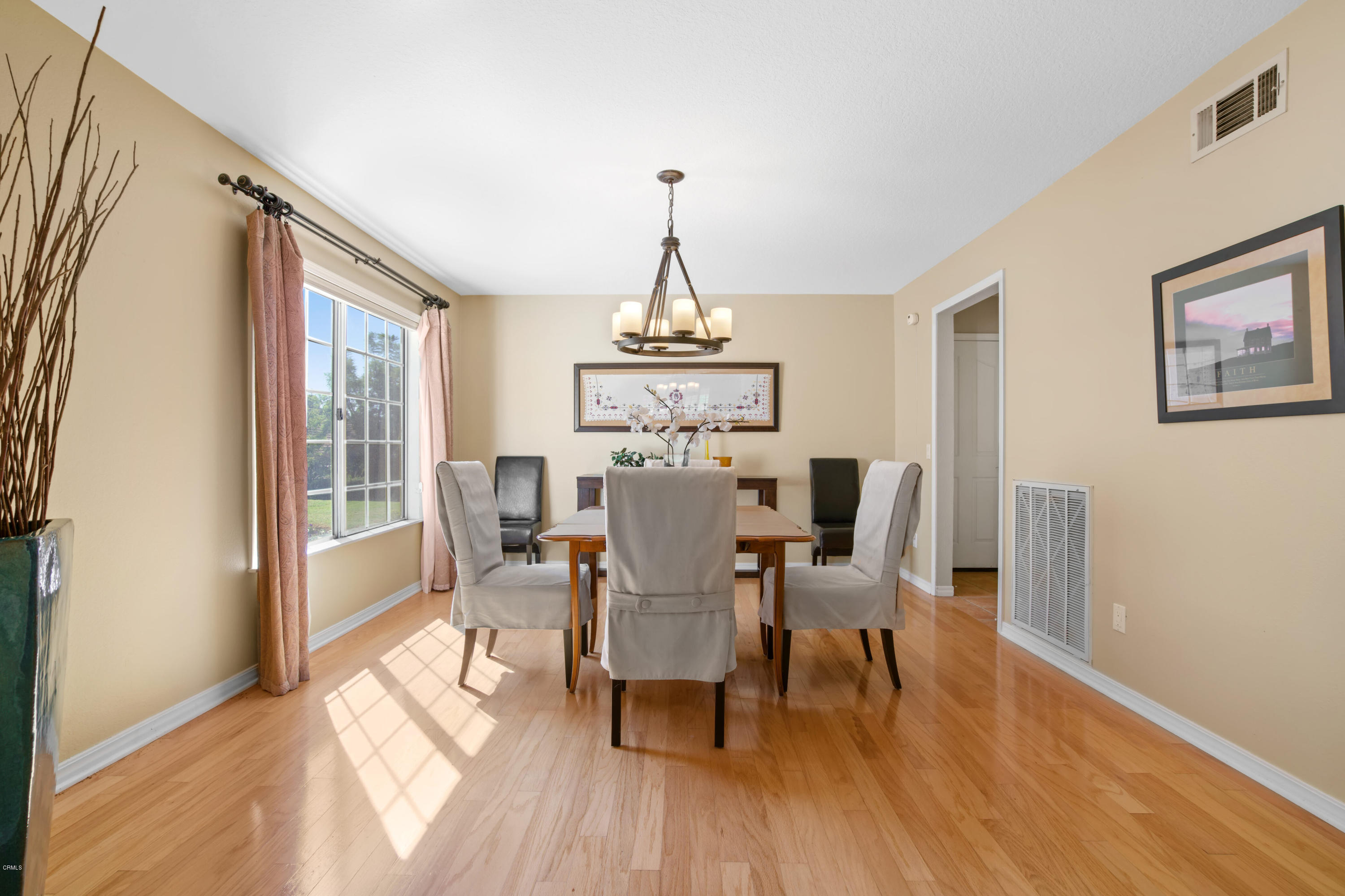6670 Armitos Drive Camarillo, CA 93012 - Photo 8 of 35 a dining room with furniture window and wooden floor